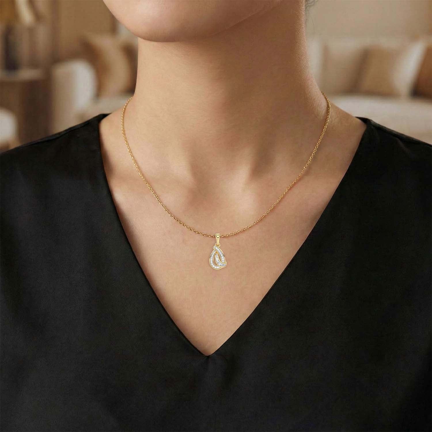 LADIES PENDANT 0.15CT ROUND/BAGUETTE DIAMOND 10K YELLOW GOLD